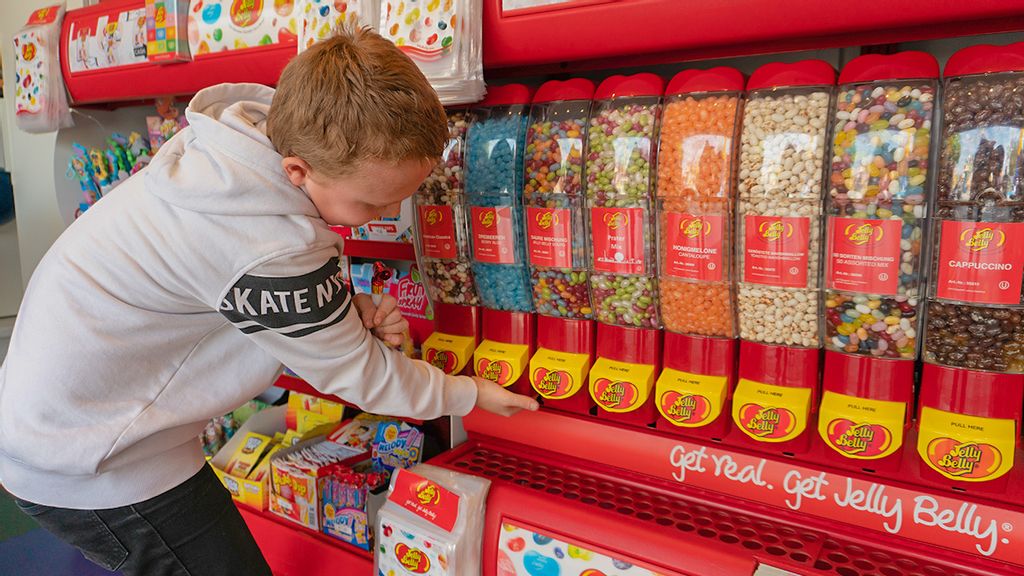 Abbildung eines Süßigkeitenkartons gefüllt mit bunten Jelly Beans.  