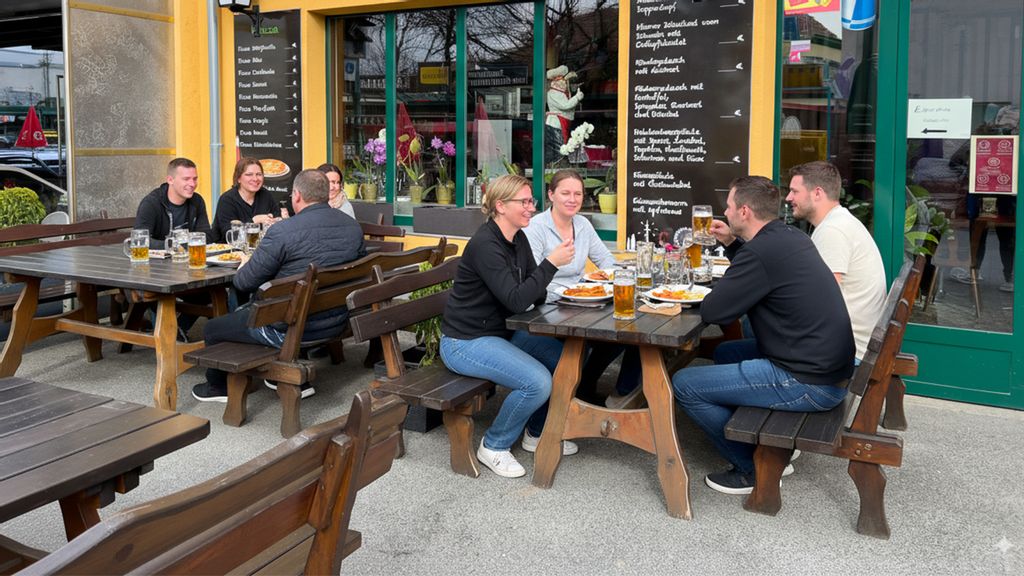 Gäste sitzen im Gastgarten der Prater Schwemme
