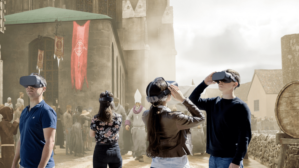 Zwei Kinder und zwei Erwachsene mit VR-Brillen in Mittelalterszene