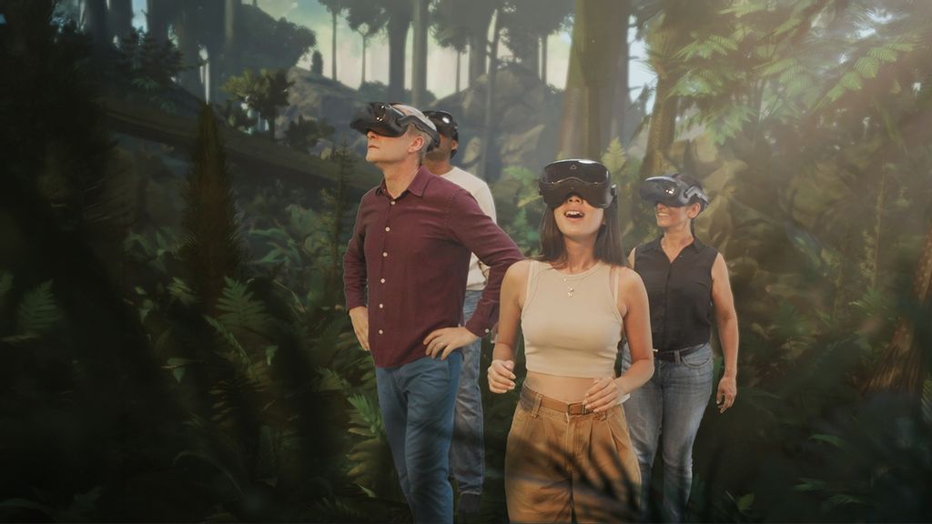 Vier Personen tragen eine VR-Brille und schauen sich im Dschungel um
