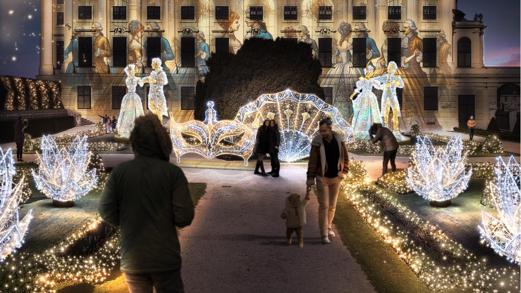 © Multidekor Illumination Personen wandern durch den beleuchteter Garten vor dem Schloss Schönbrunn